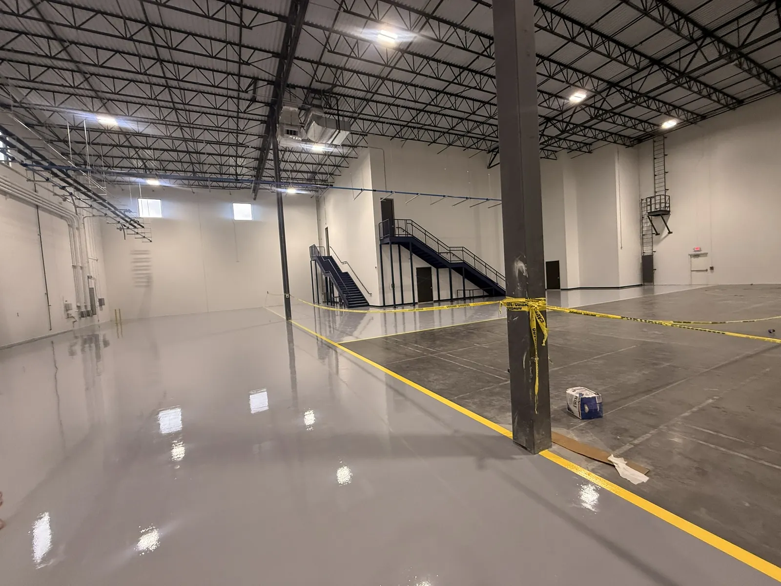 Warehouse floor, Solid grey epoxy, safety lines