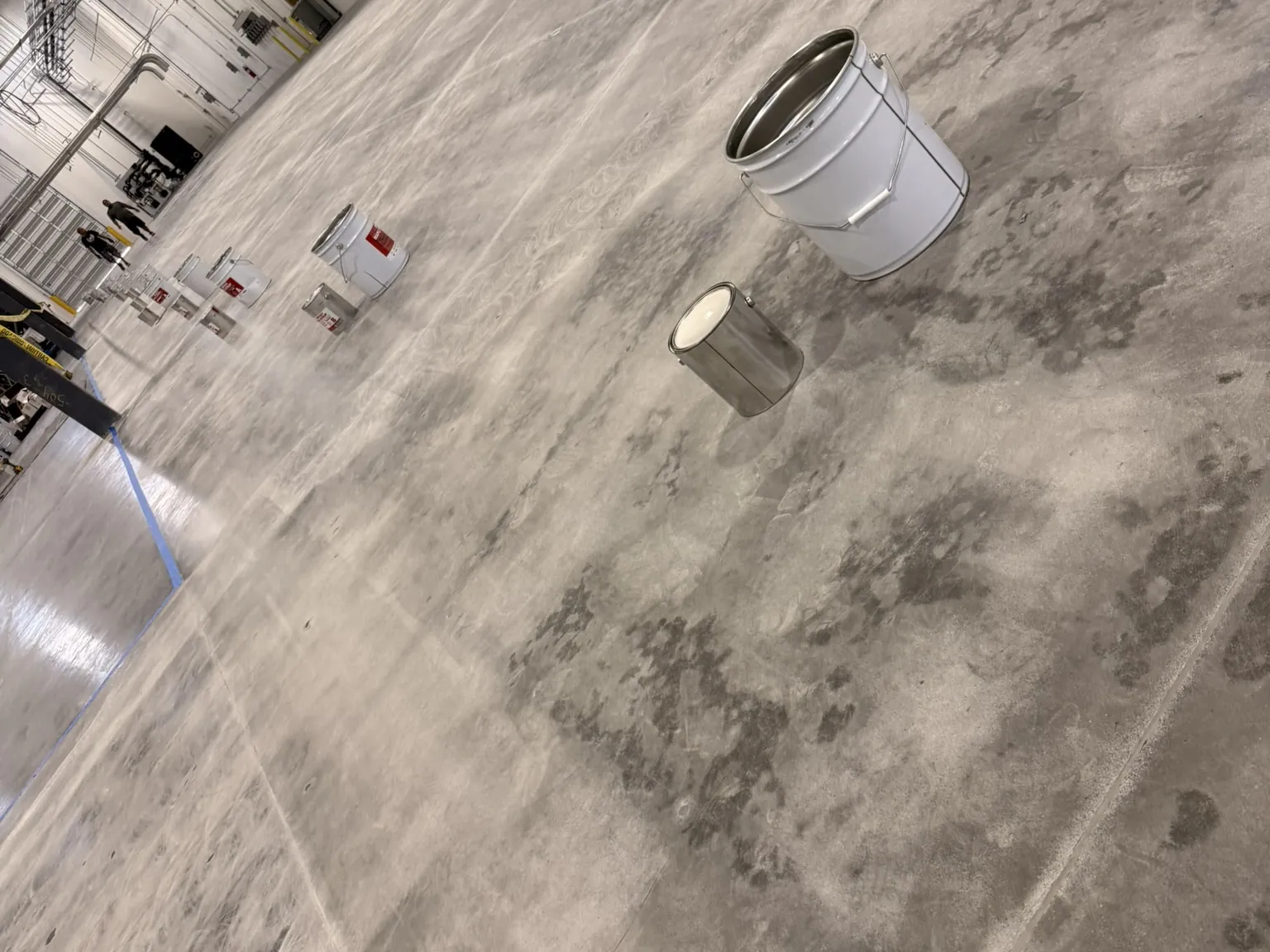 Warehouse floor, Solid grey epoxy, safety lines, before